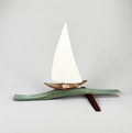 Sailboat on thin wave